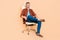 Full length photo of bossy smart partner middle-aged guy sit leather chair isolated over pastel beige color background