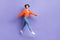 Full length photo of careless good mood youngster active girl orange knitwear denim jeans walking flying pleasure