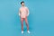 Full length photo of charming young happy man look dreamy empty space isolated on pastel blue color background