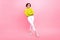 Full length photo of confident cheerful girl dressed neon sweater walking arms crossed isolated pink color background