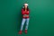 Full length photo of confident funny lady wear red ugly print xmas sweater cap arms folded isolated green color
