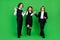 Full length photo of cool little girl boys hold hands go wave wear school uniform isolated on green background