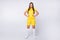 Full length photo of cool sporty lady skilled player soccer women team arms by sides wear yellow football uniform yellow