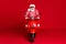 Full length photo of crazy retired old man moped enjoy ride empty windy highway open mouth wear santa x-mas costume