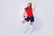 Full length photo delighted soccer player girl hold foot ball celebrate national team cup tournament win raise fists