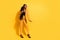 Full length photo of funky young lady stand show small wear suit high heels isolated on yellow background