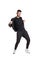 Full-length photo of a funny guy dancing in studio isolated on white background.