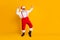 Full length photo of grey hair cool funny santa claus in red x-mas hat enjoy newyear christmas magic tradition