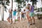 Full length photo of group carefree overjoyed people have fun dancing sand beach entertainment acoustic guitar music
