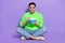 Full length photo of impressed funny guy dressed neon sweatshirt eating pop corn watching movie isolated violet color