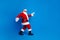 Full length photo of mature pensioner man sneak go deliver gifts wear trendy santa claus costume coat isolated on blue