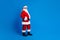 Full length photo of mature pensioner man touch belt shopping wear trendy santa claus costume coat isolated on blue