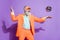 Full length photo of old cheerful positive man disco ball throw wear sunglass enjoy isolated on purple color background