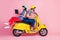 Full length photo of positive cheerful two people bikers drive yellow chopper woman sit backside browse internet