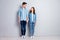 Full length photo of positive passionate students woman man spouses hold hand look good enjoy togetherness wear casual