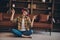 Full length photo of pretty millennial bob hairdo lady listen music dance wear shirt jeans bare foot at home loft flat