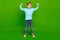 Full length photo of pretty strong small son wear turquoise turtleneck rising fists isolated green color background