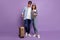 Full length photo of two people couple guy lady walking airport registration tickets passports baggage vacation time