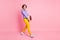 Full length photo of upset lady nerd carry many book heavy tests wear jumper pants shoes isolated pink color background