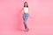 Full length photo of young attractive lady show hand little small size measure  over pink color background