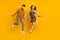 Full length photo of young couple jump up excited active wear bowtie plaid dress trousers isolated on yellow color