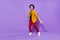 Full length photo of young guy happy positive smile funny clubber dancer isolated over purple color background