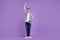 Full length photo of young handsome man good mood standing dancer isolated over violet color background