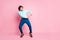 Full length photo of young handsome man move dance enjoy look empty space isolated over pink color background