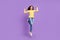 Full length photo of young sportive girl show arms muscles exercise jump isolated over violet color background