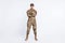 Full length photo of young woman confident crossed hands soldier officer army camouflage uniform isolated over white