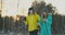 Full length portrait of active young couple enjoying skiing in snowy winter forest, focus on smiling woman in front