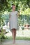 Full length portrait of beautiful barefooted young women standing in the backyard