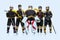 Full-length portrait of boys, children, professional hockeys player  over white background. Team spirit