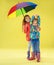 A full length portrait of a bright fashionable girls in a raincoat