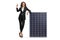 Full length portrait of a businesswoman leaning on a solar panel and pointing up