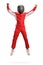 Full length portrait of a car racer with a helmet jumping and gesturing happiness
