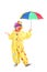 Full length portrait of a cheerful clown holding an umbrella