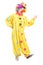 Full length portrait of a cheerful clown in a yellow costume