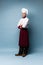 Full length portrait of cheerful joyful chef cook with stubble in beret and white outfit looking at camera isolated