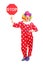Full length portrait of a clown holding a stop sign