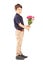 Full length portrait of a cute little boy holding bunch of flowers