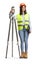 Full length portrait of a female geodetic surveyor with a measuring device