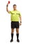 Full length portrait of a football referee giving a red card