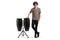 Full length portrait of a guy leaning on conga drums