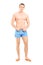 Full length portrait of a handsome muscular man posing in swimsuit