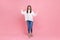 Full length portrait of happy female waving hands to camera, having good mood, greeting her friend.