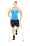 Full length portrait of an injured male athlete with crutches