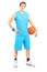 Full length portrait of a male basketball player holding a ball