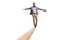 Full length portrait of a male teacher holdind a book and walking on a wooden beam