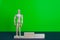 Full length portrait of male winner on winner's pedestal, on green background. The composition of 3 components: 3 place